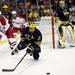 Michigan junior defenseman Mac Bennett is tripped while skating after a puck in the game against Miami on Saturday, March 23. Daniel Brenner I AnnArbor.com